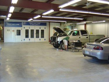 51 Auto Body Shop Interior with Employee working on pickup